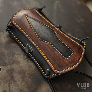 Leather archery armguard with a bodkin arrowhead pattern panel