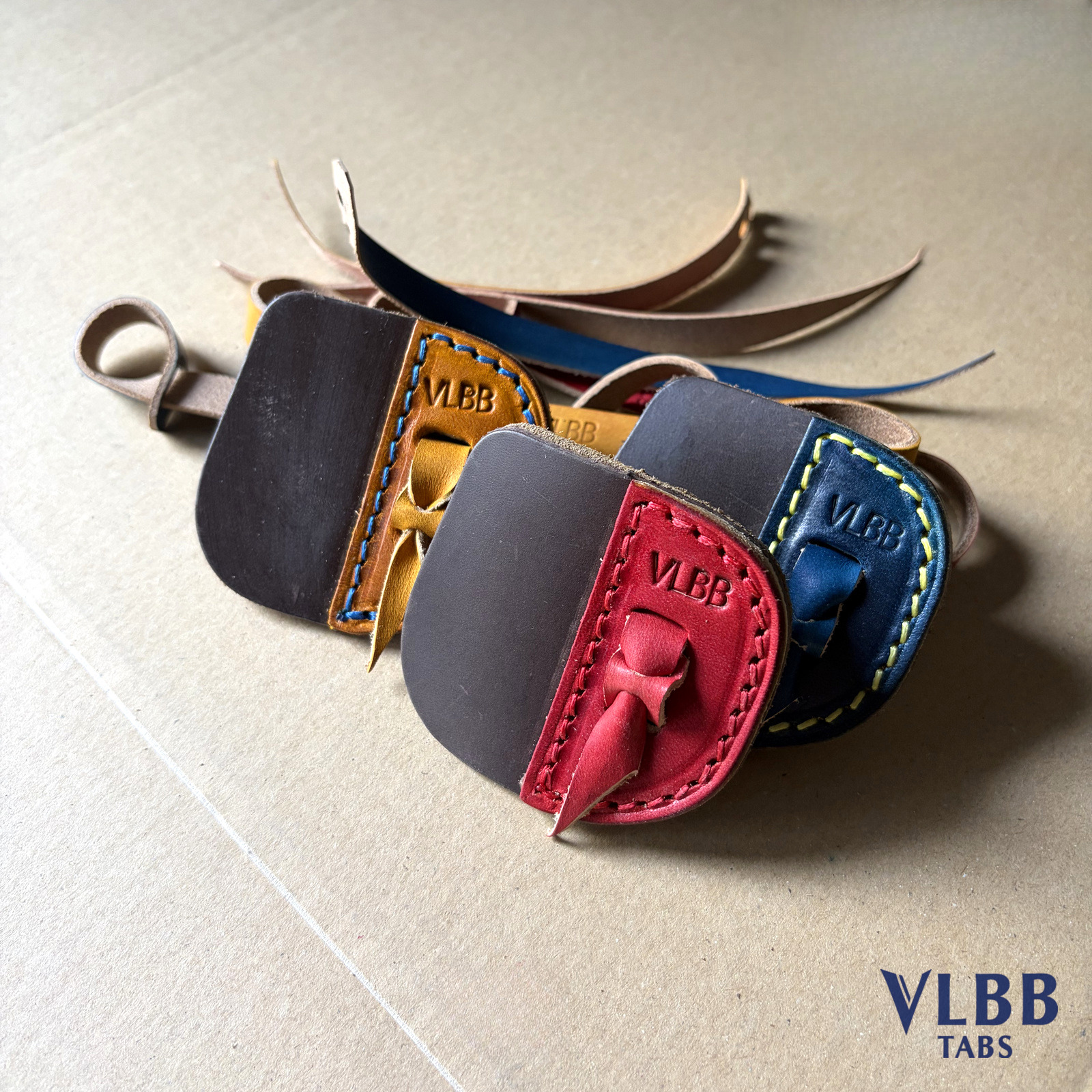 Calfskin tabs in several leather and thread colours